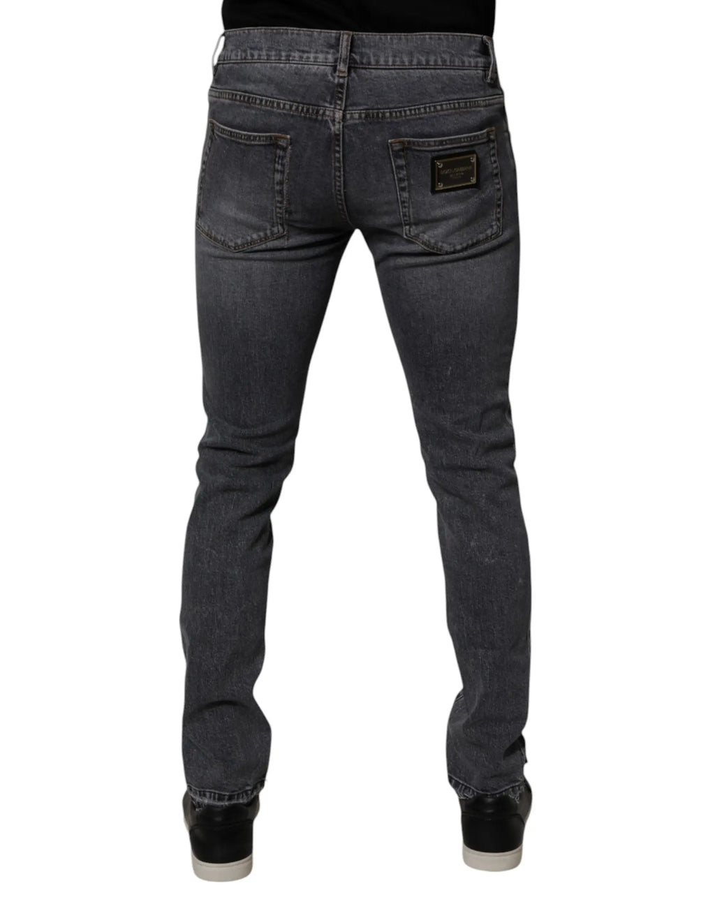 Jeans slim en denim stretch coton gris foncé dolce & gabbana vue arrière avec patch cuir noir sur la poche arrière droite