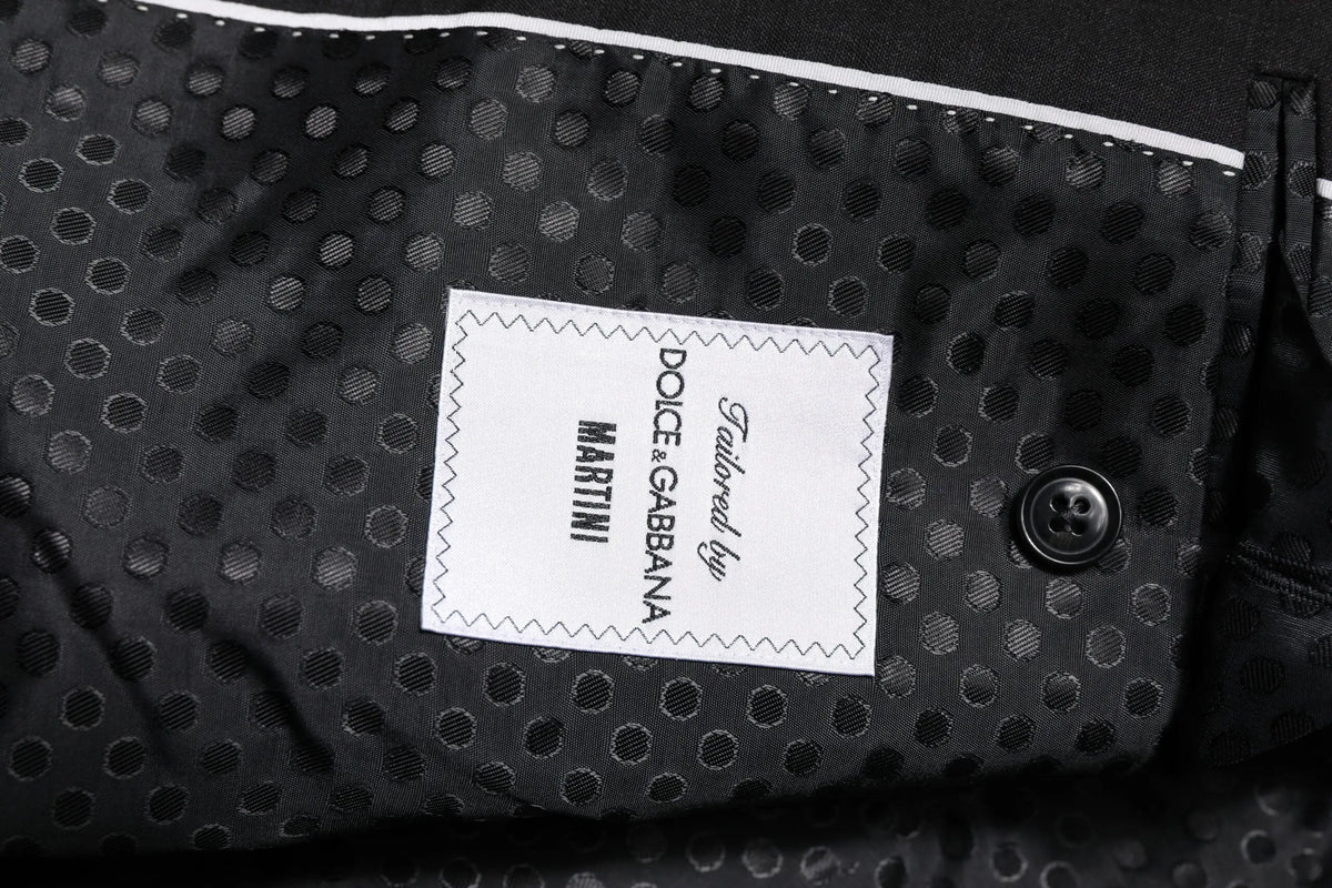 Tissu à pois noirs avec étiquette blanche tailored by dolce & gabbana martini et bouton noir de veste grise foncée martini