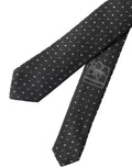 Cravate homme dolce & gabbana en soie gris foncé à pois argentés avec étiquette de marque visible