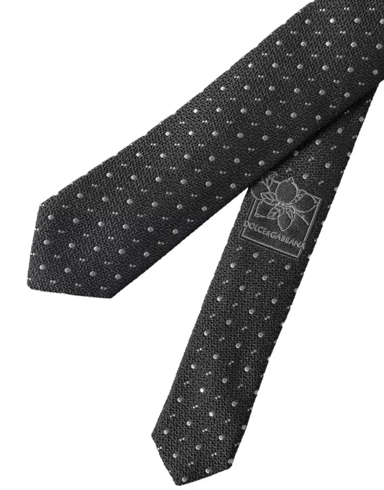 Cravate homme dolce & gabbana en soie gris foncé à pois argentés avec étiquette de marque visible