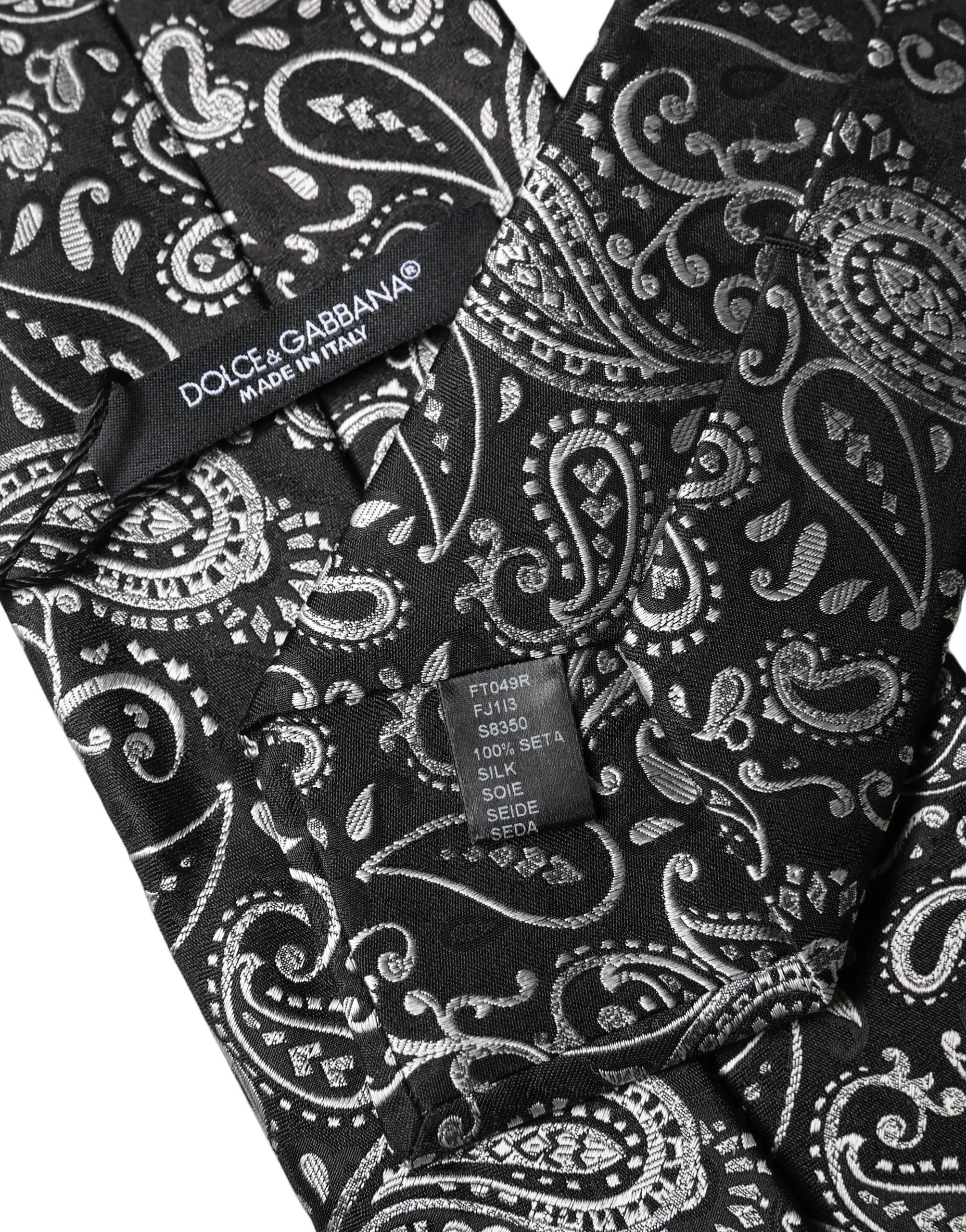 Cravate pour femme dolce & gabbana en soie noire avec motif paisley argenté et étiquette made in italy