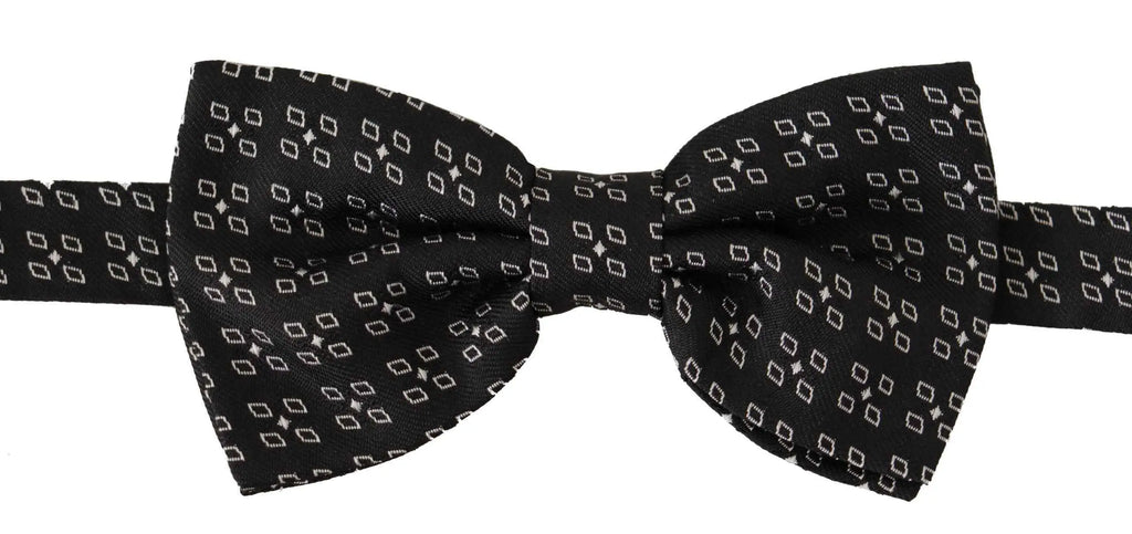 Noeud papillon dolce gabbana en soie noire avec motif géométrique subtil blanc étoiles et losanges