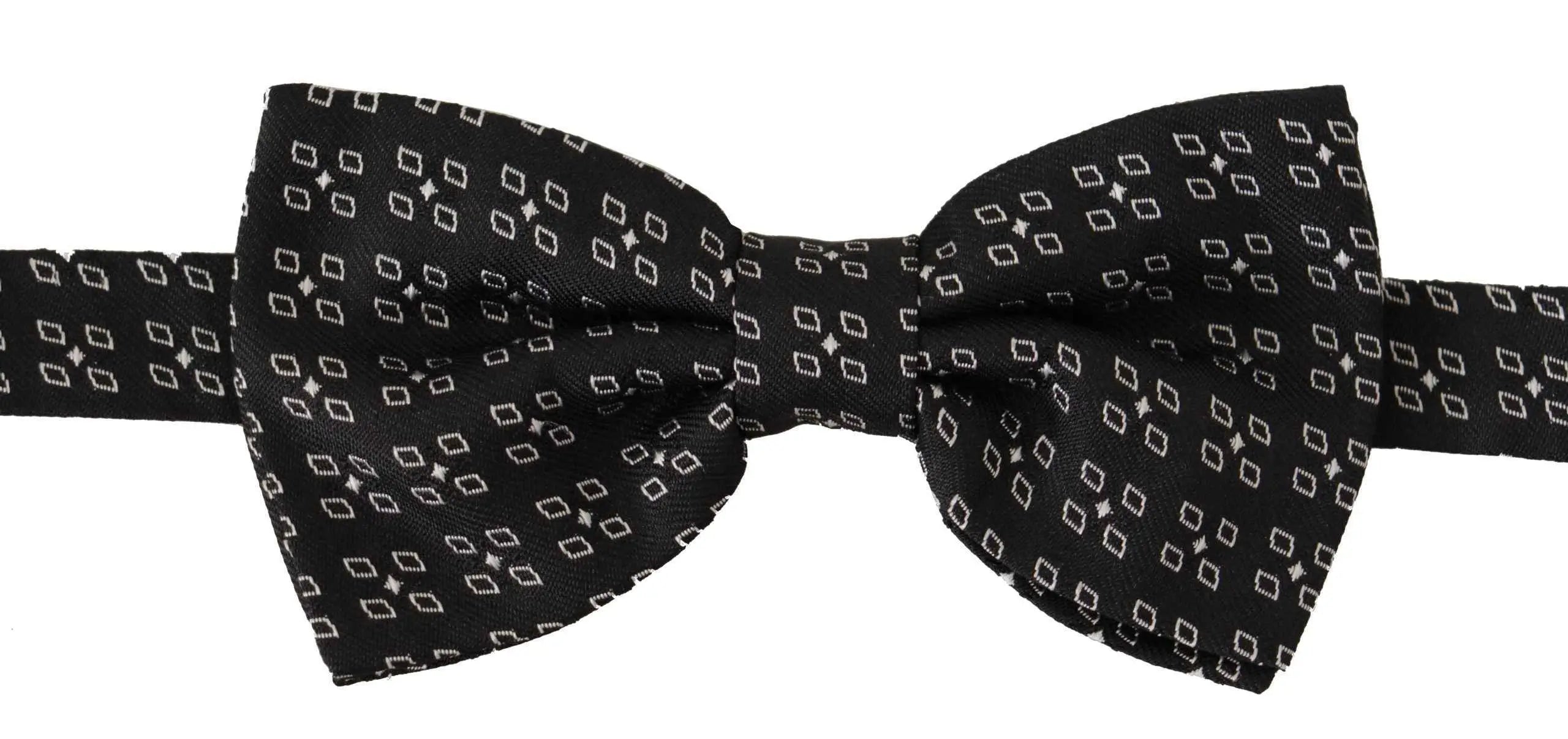 Noeud papillon dolce gabbana en soie noire avec motif géométrique subtil blanc étoiles et losanges