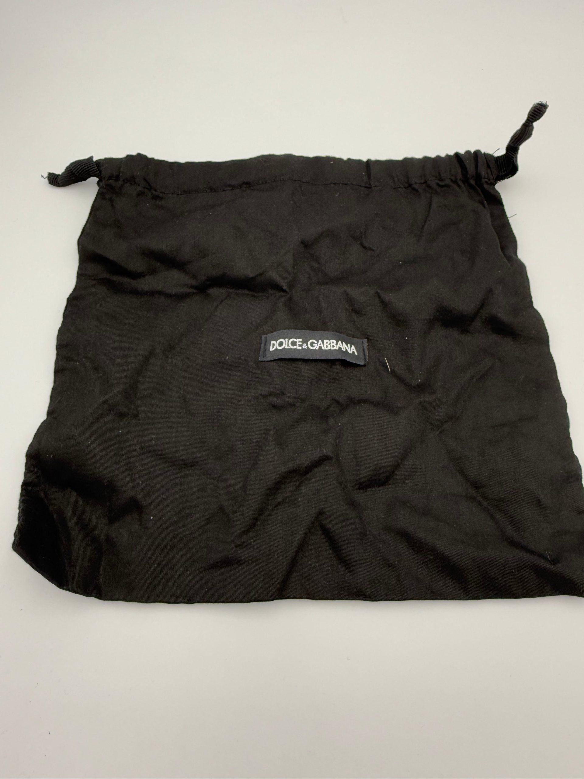 Sac à main Dolce & Gabbana Sicily en peau de reptile, détaillé avec finition élégante, idéal pour un style sophistiqué.