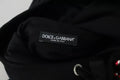 Étiquette noire dolce & gabbana avec texte blanc indiquant made in italy sur pull à capuche sequins noir