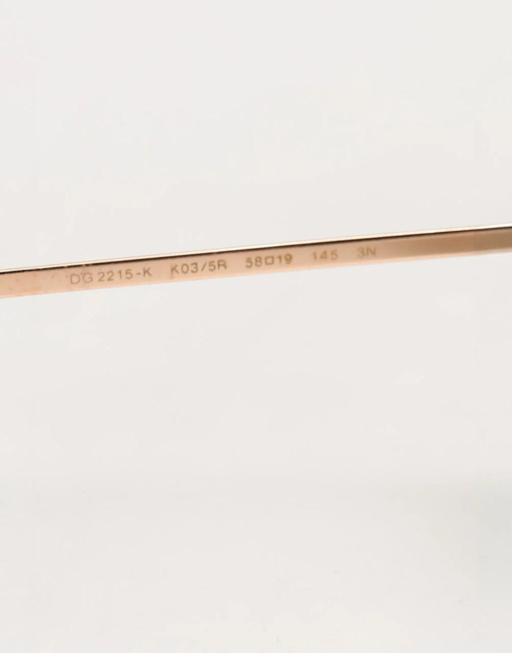 Temple en métal rose gold de lunettes de soleil dolce & gabbana dg2215k avec modèle et spécifications gravés vue arrière