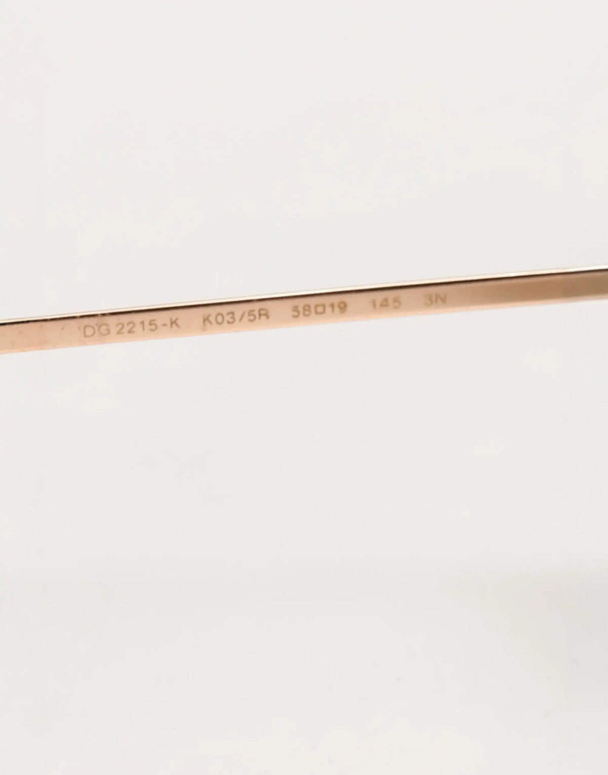 Temple en métal rose gold de lunettes de soleil dolce & gabbana dg2215k avec modèle et spécifications gravés vue arrière