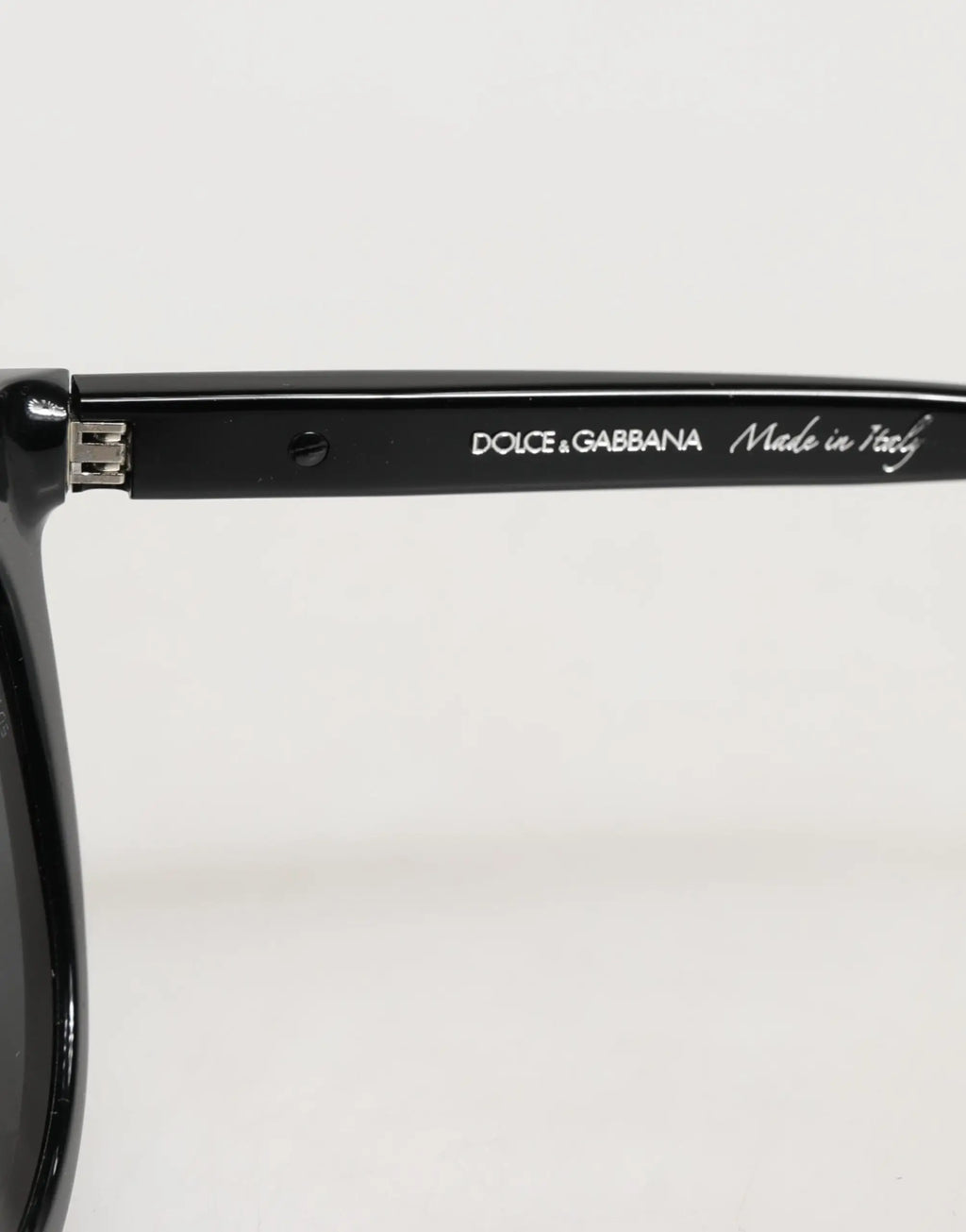 Lunettes de soleil dolce & gabbana dg4281 noires monture ronde pleine avec finition brillante élégante et branding visible