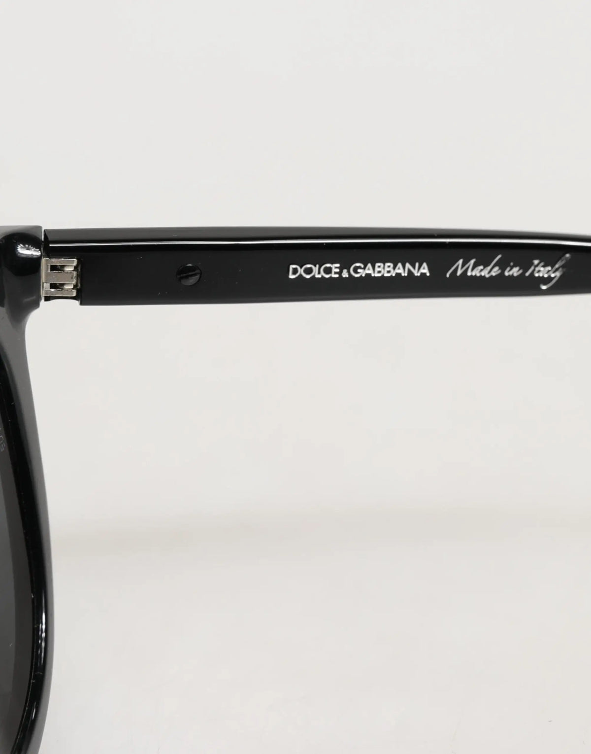 Lunettes de soleil dolce & gabbana dg4281 noires monture ronde pleine avec finition brillante élégante et branding visible