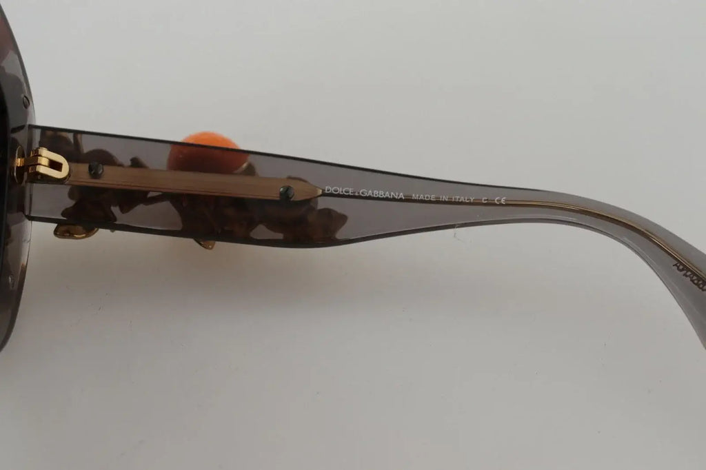 Lunettes de soleil dolce & gabbana dg4283b en acétate écaille avec appliques orange et monture dorée courbée élégante