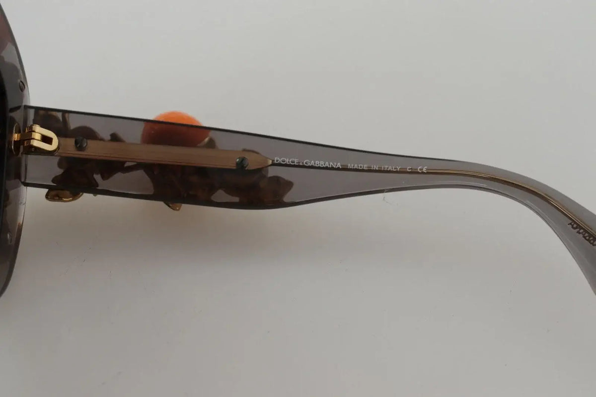 Lunettes de soleil dolce & gabbana dg4283b en acétate écaille avec appliques orange et monture dorée courbée élégante