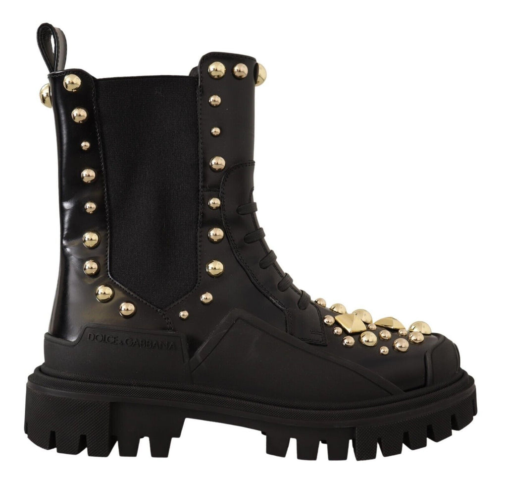 Bottes combat en cuir noir Dolce & Gabbana avec clous, style robuste et tendance, vue de face avec détails en cuir et semelle épaisse.
