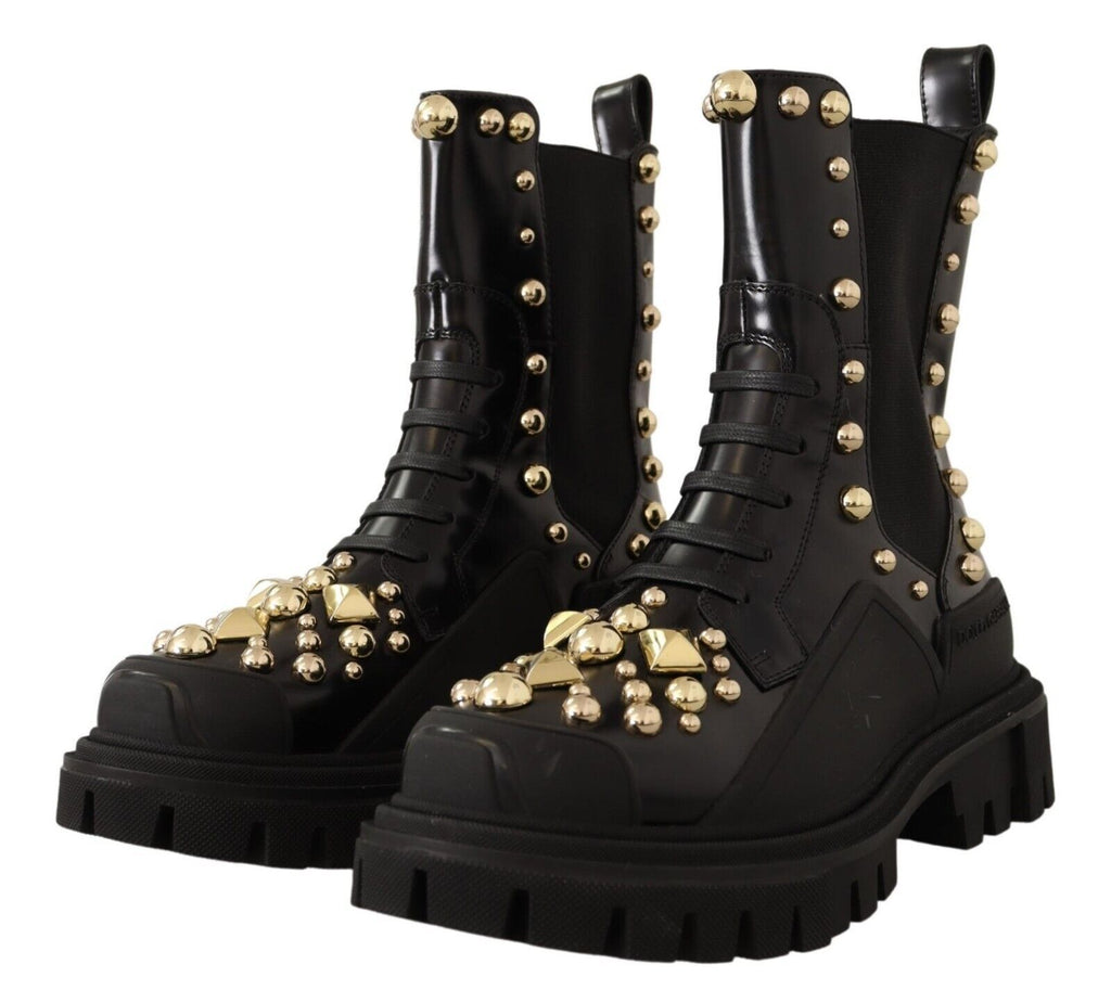 Bottes de combat en cuir noir Dolce & Gabbana avec clous, style robuste et élégant, visibles sur l'image.