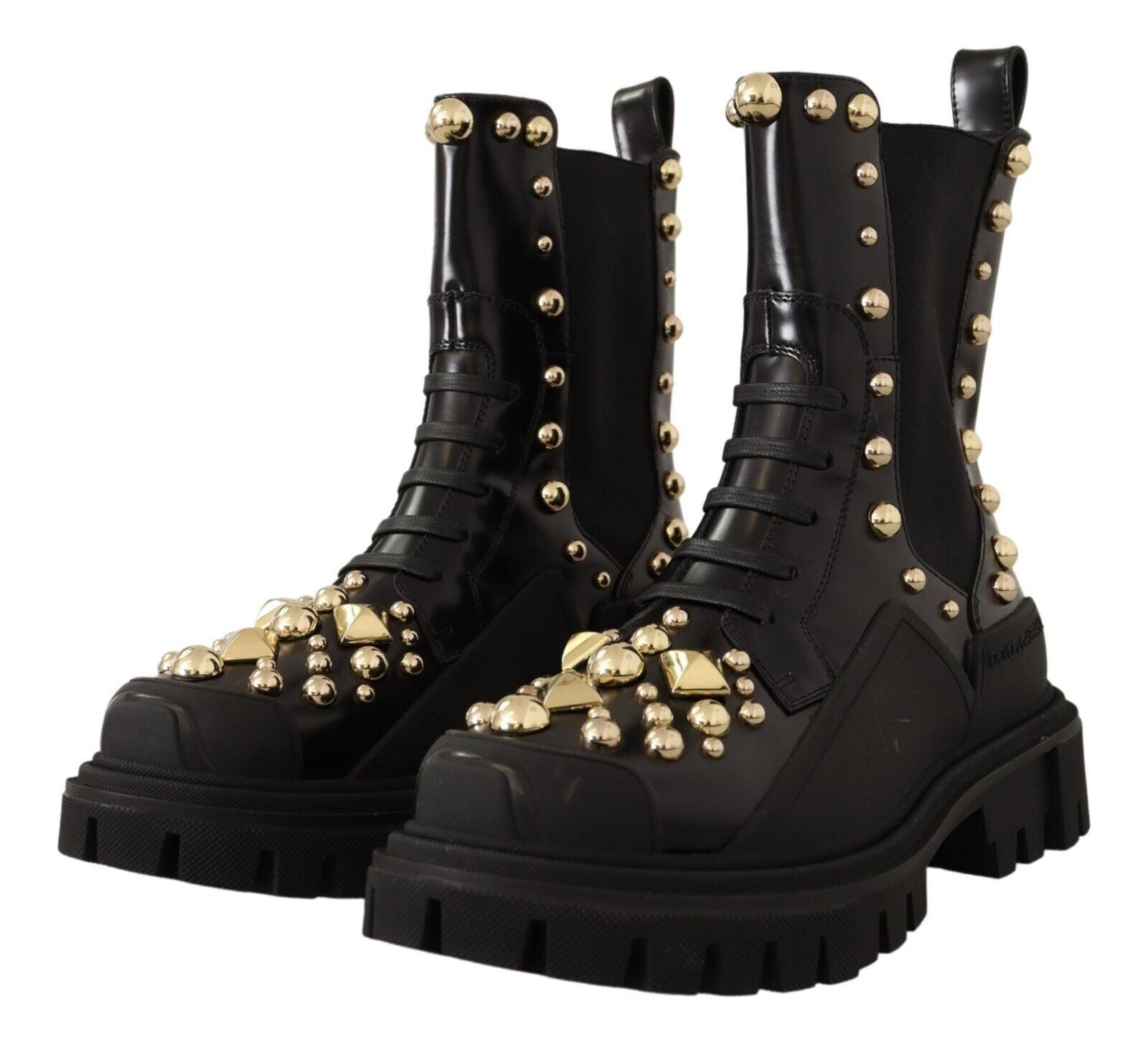 Bottes de combat en cuir noir Dolce & Gabbana avec clous, style robuste et élégant, visibles sur l'image.