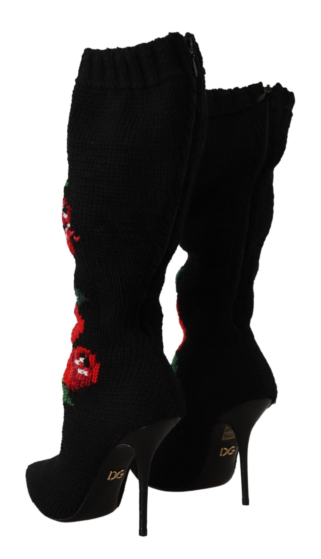 Chaussettes extensibles noires Dolce & Gabbana avec motifs de roses rouges, portées avec des bottines élégantes.