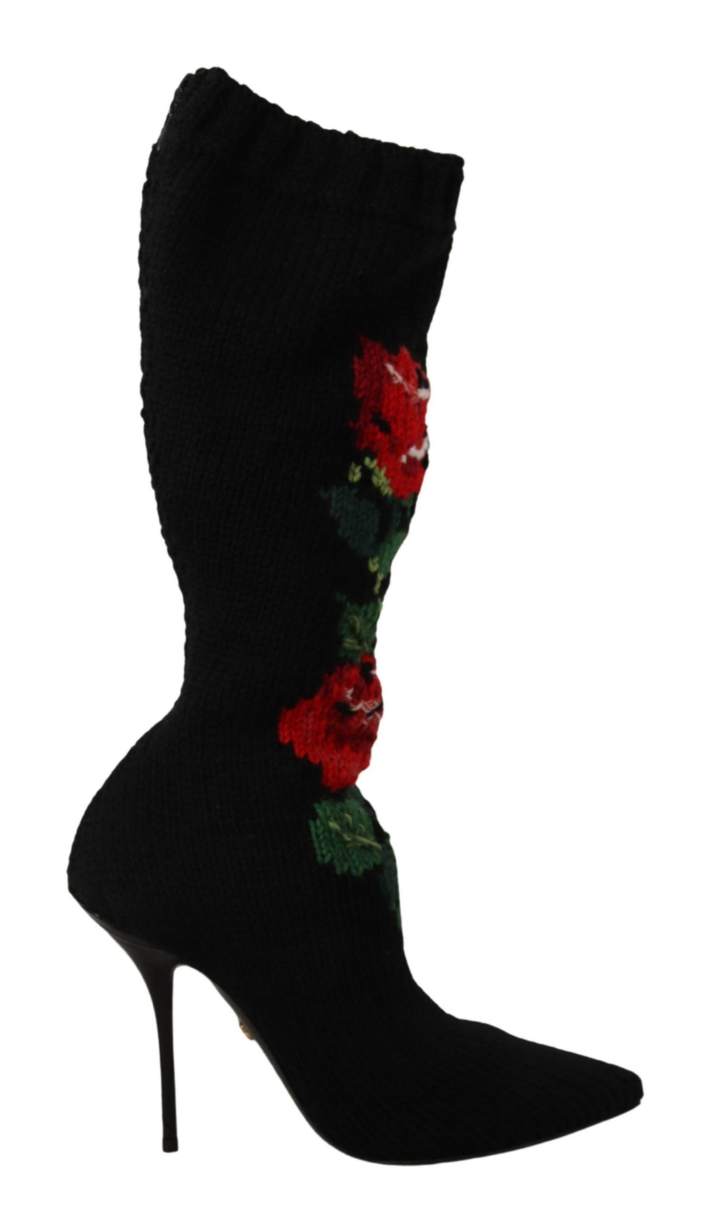 Chaussettes extensibles noires Dolce & Gabbana avec motifs de roses rouges, portées avec des bottines élégantes.