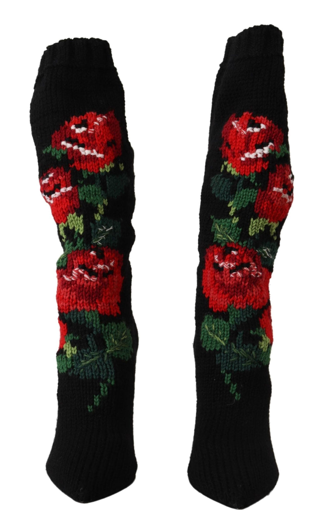 Chaussettes noires extensibles Dolce & Gabbana avec motifs de roses rouges, portées avec des bottines élégantes.