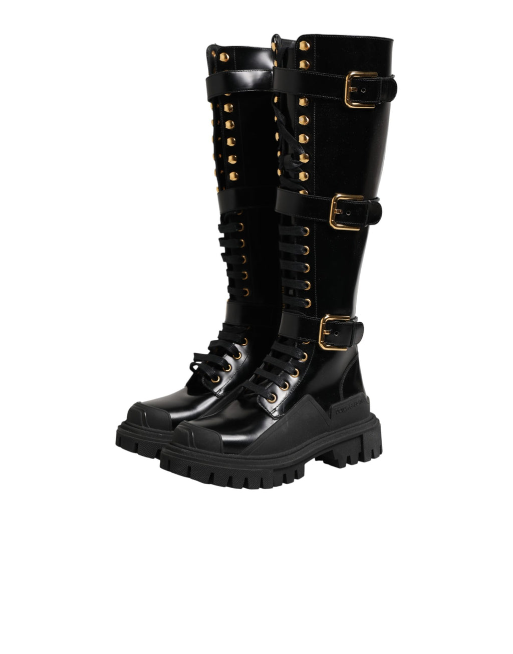 Bottes noires Dolce & Gabbana, à boucle ornée et hauteur genou, en cuir élégant, pour un style sophistiqué et tendance.