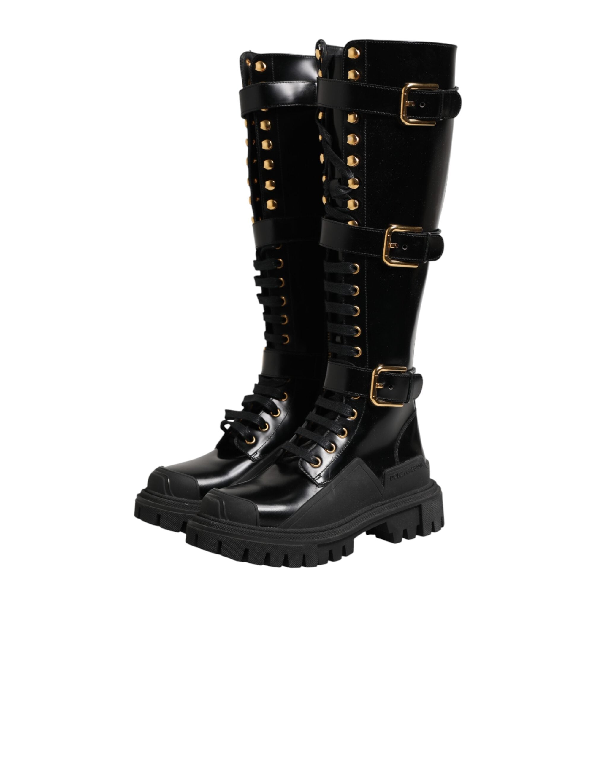 Bottes noires Dolce & Gabbana, à boucle ornée et hauteur genou, en cuir élégant, pour un style sophistiqué et tendance.