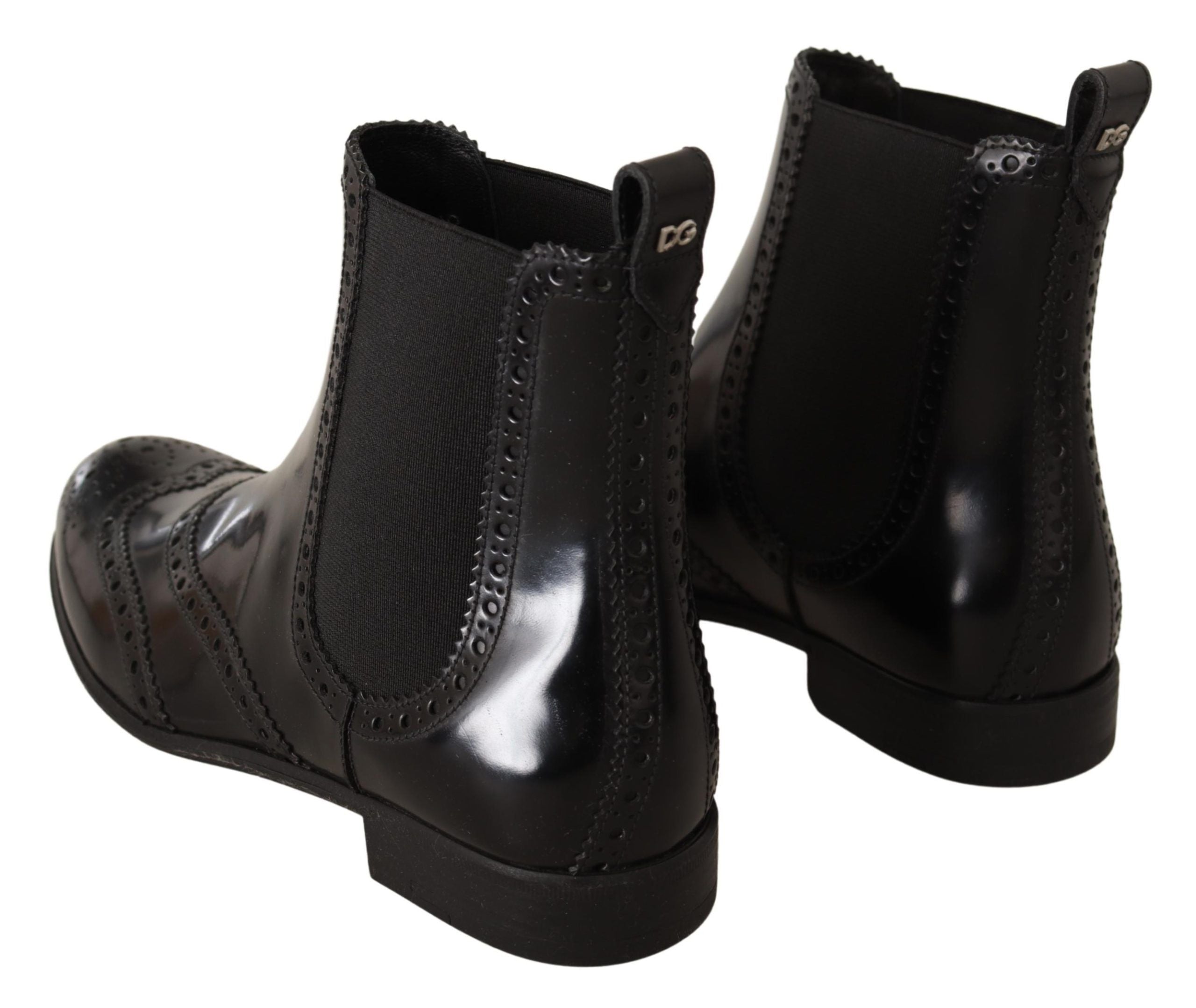 Bottes plates noires en cuir à la cheville de Dolce & Gabbana, chaussures élégantes et confortables pour un style sophistiqué.