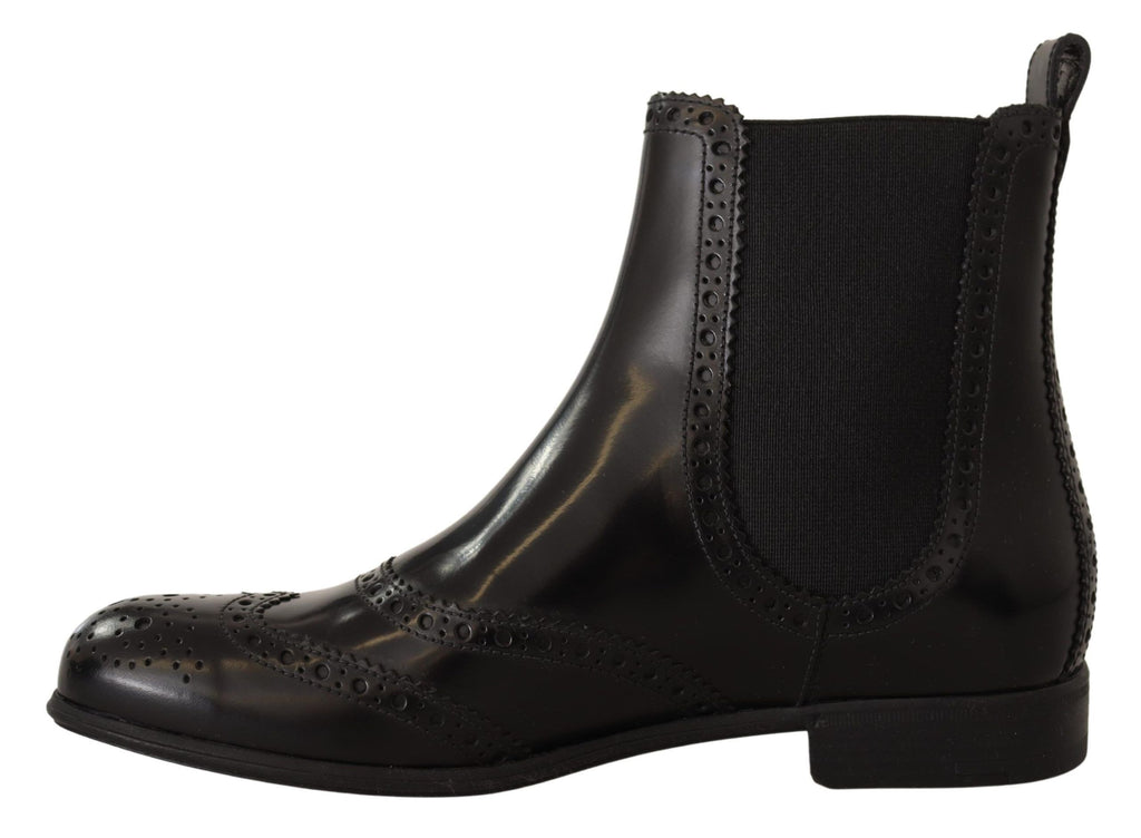Bottes plates noires en cuir à la cheville de Dolce & Gabbana, chaussures élégantes et confortables pour femmes.