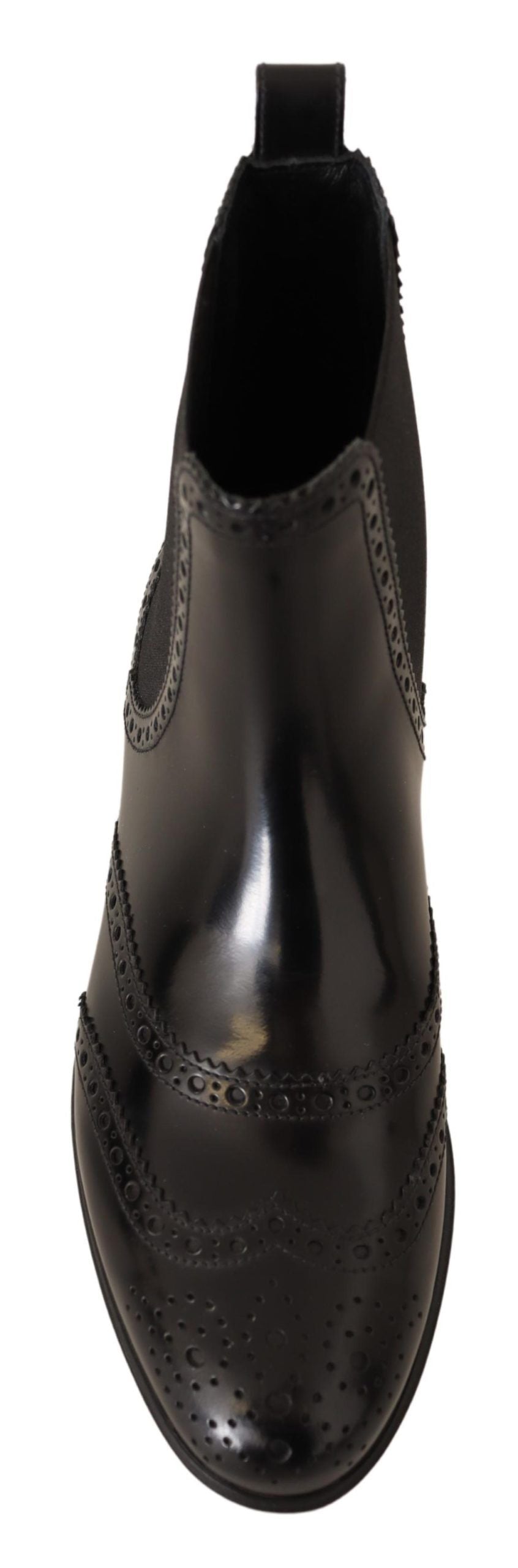 Bottes plates en cuir noir Dolce & Gabbana, bottines hautes à la cheville avec semelle plate, style élégant et sophistiqué.