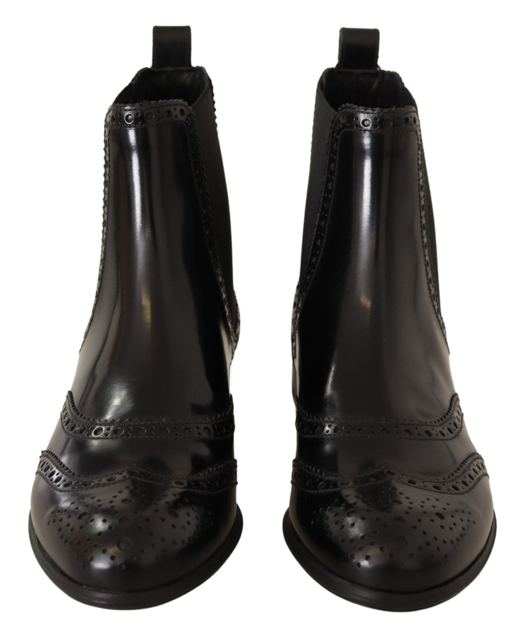 Bottes plates noires en cuir à la cheville de Dolce & Gabbana, style élégant et moderne, visibles sur l'image.
