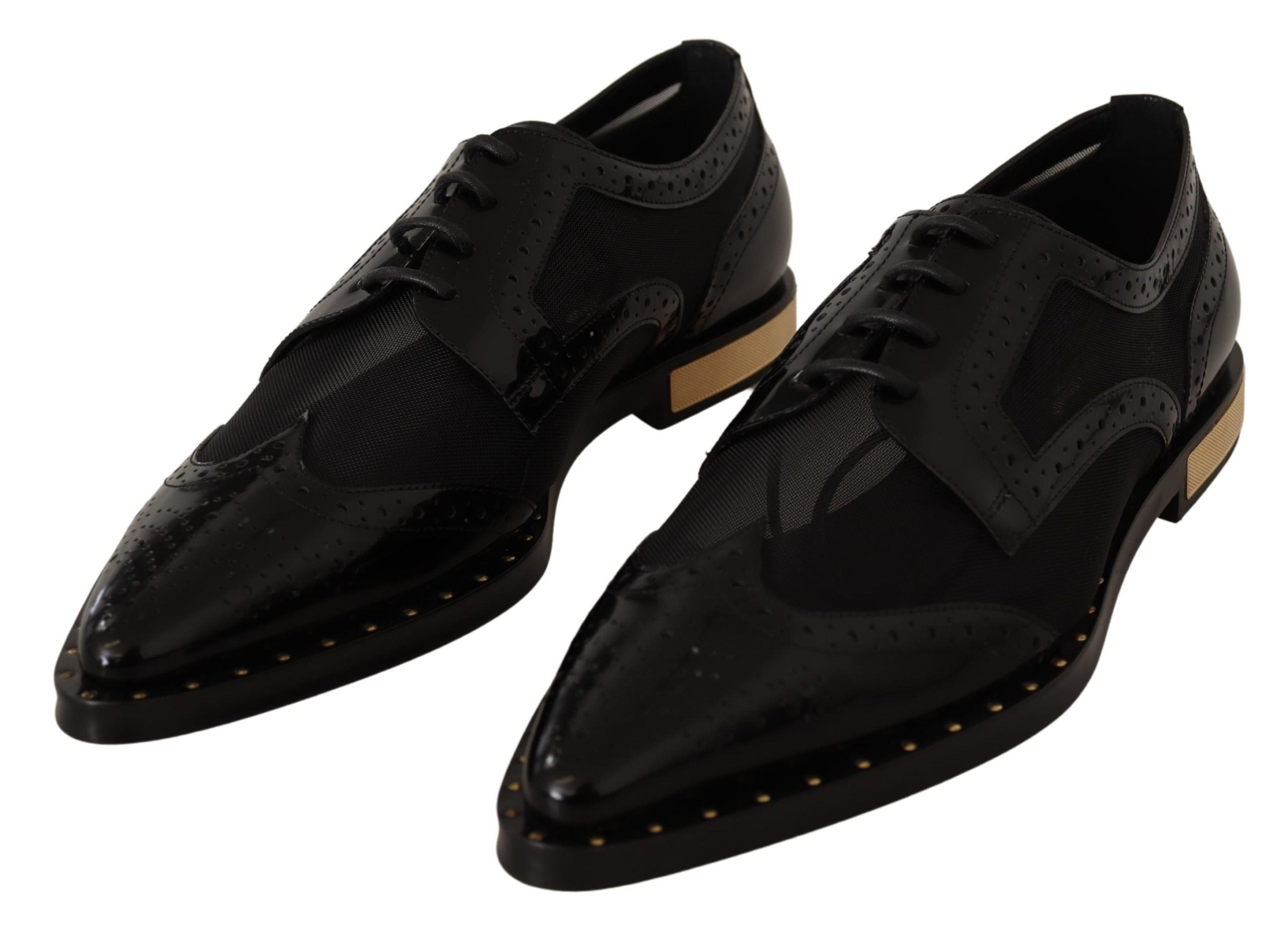 Chaussures wingtip en cuir noir Dolce & Gabbana, brogue transparent, vue en gros plan sur le modèle.