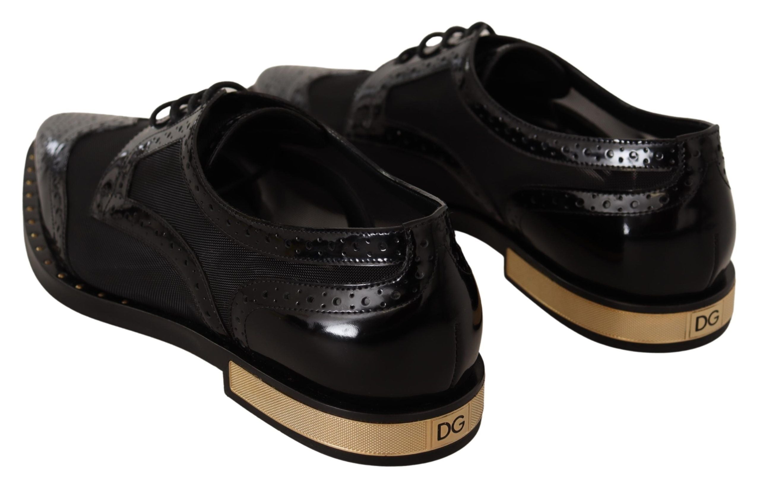 Chaussures wingtip en cuir noir de Dolce & Gabbana avec détails transparents et finition élégante.
