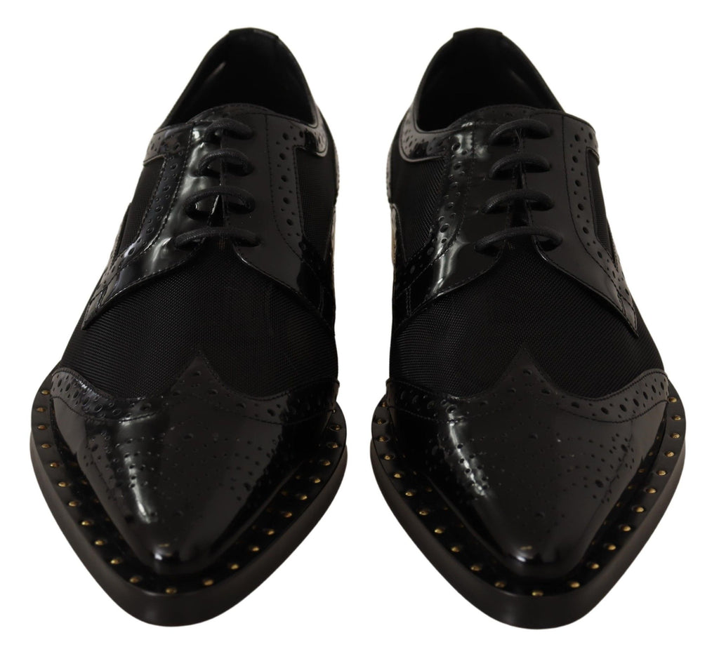 Chaussures wingtip en cuir noir de Dolce & Gabbana, brogues élégantes avec détails en voile transparent.
