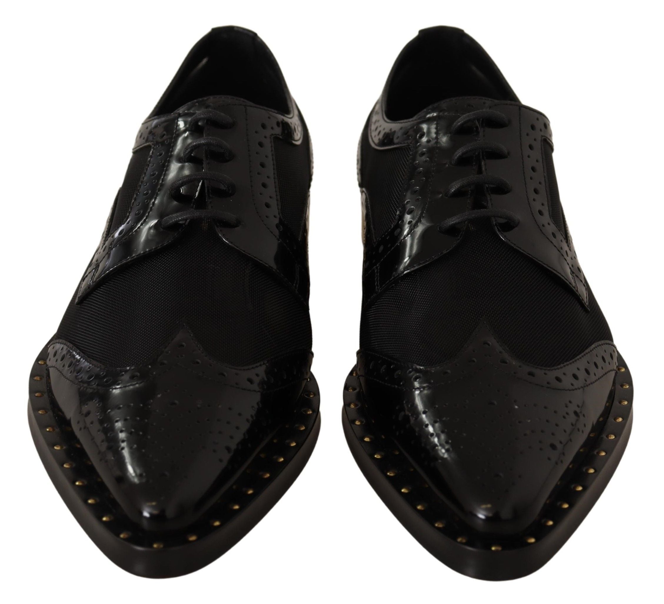 Chaussures wingtip en cuir noir de Dolce & Gabbana, brogues élégantes avec détails en voile transparent.