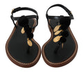 Sandales à enfiler Dolce & Gabbana en cuir noir avec détail de pièces de monnaie, chaussures d'été élégantes et confortables.