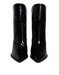 Bottes noires en cuir verni à bout pointu de Dolce & Gabbana, chaussures élégantes pour la cheville.