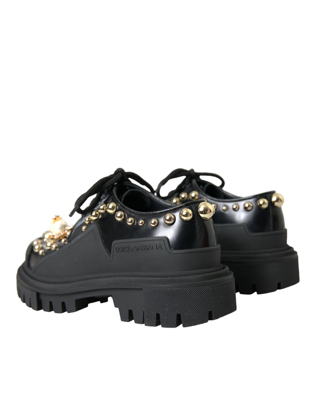 Chaussures de randonnée Derby en cuir noir Dolce & Gabbana avec embellissements, vue de face sur fond neutre.
