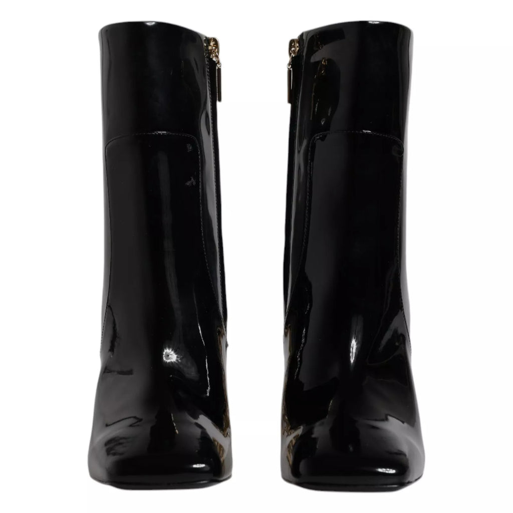 Bottes en cuir noir Dolce & Gabbana Jackie mi-mollet, modèle élégant avec finition en cuir lisse et semelle robuste.