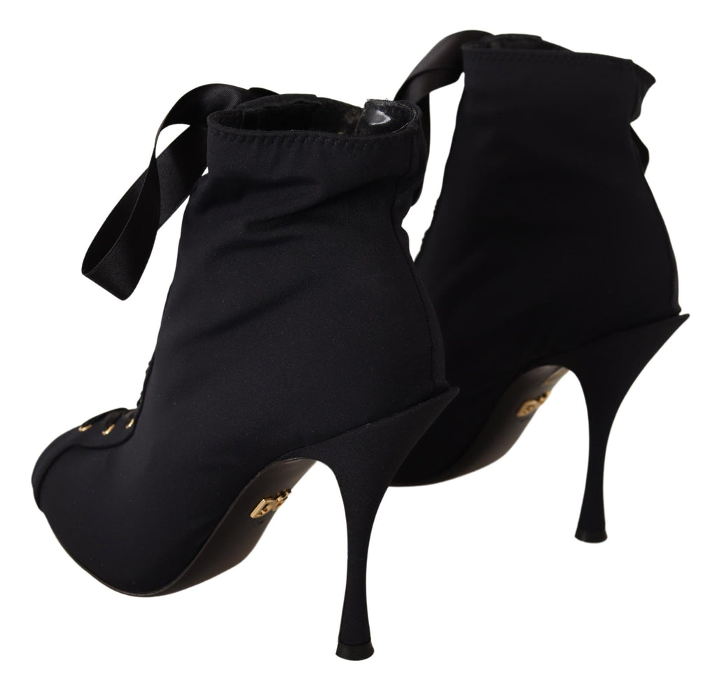 Chaussures bottines noires Dolce & Gabbana, stretch et ajustées à la cheville, style élégant et moderne.