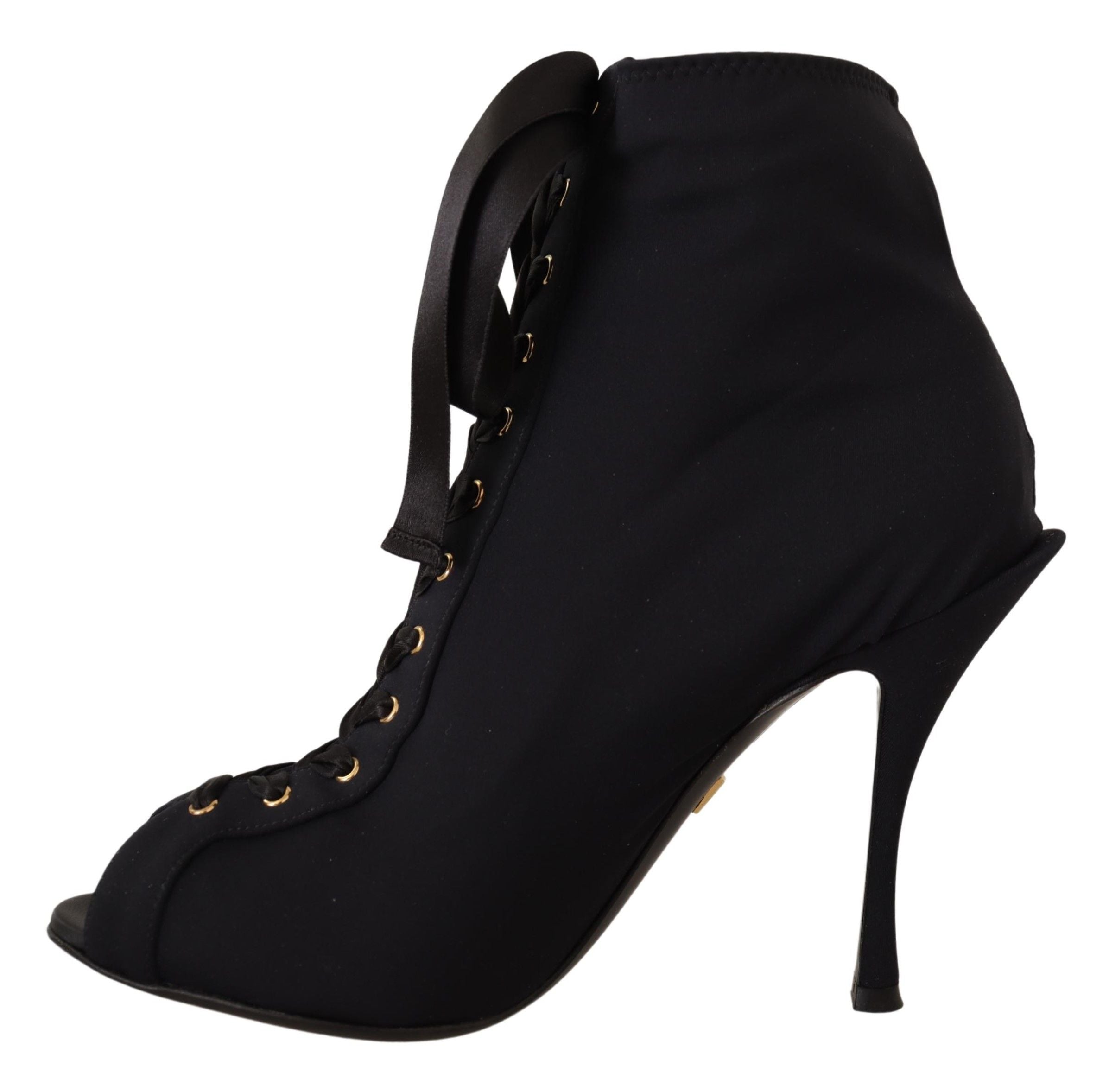 Bottines noires Dolce & Gabbana en stretch et à la cheville, vue de face sur fond blanc.