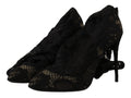 Chaussettes extensibles noires Dolce & Gabbana avec motifs en dentelle, portées avec des bottines élégantes Taormina.