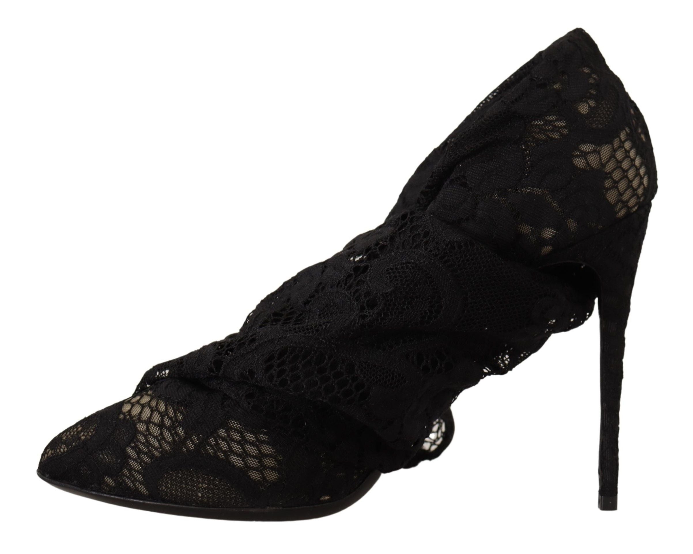 Chaussettes extensibles noires Dolce & Gabbana avec détails en dentelle Taormina, portées avec des bottines en cuir noir.