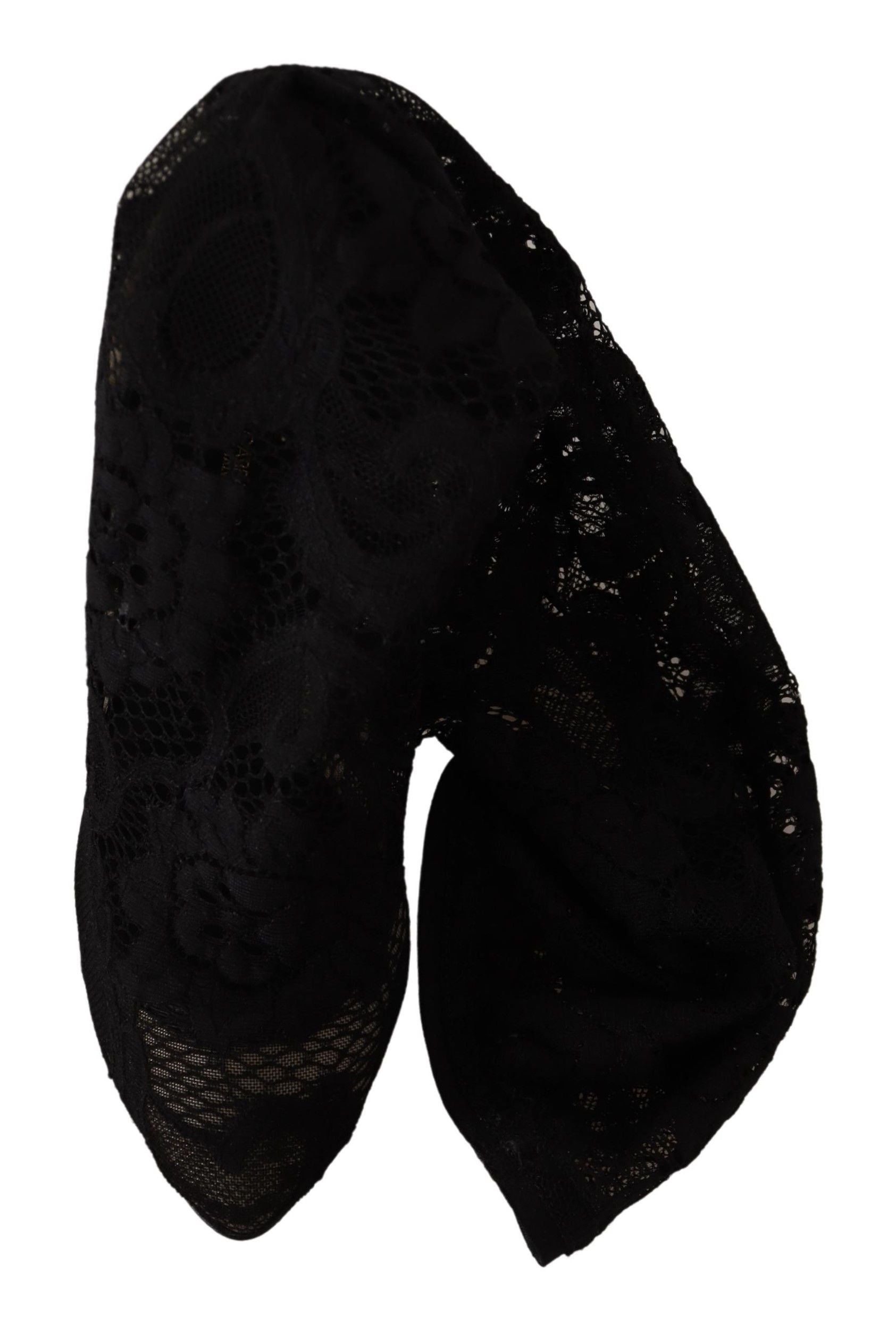 Chaussettes noires extensibles Dolce & Gabbana avec broderie en dentelle Taormina, portées avec des bottines en cuir.
