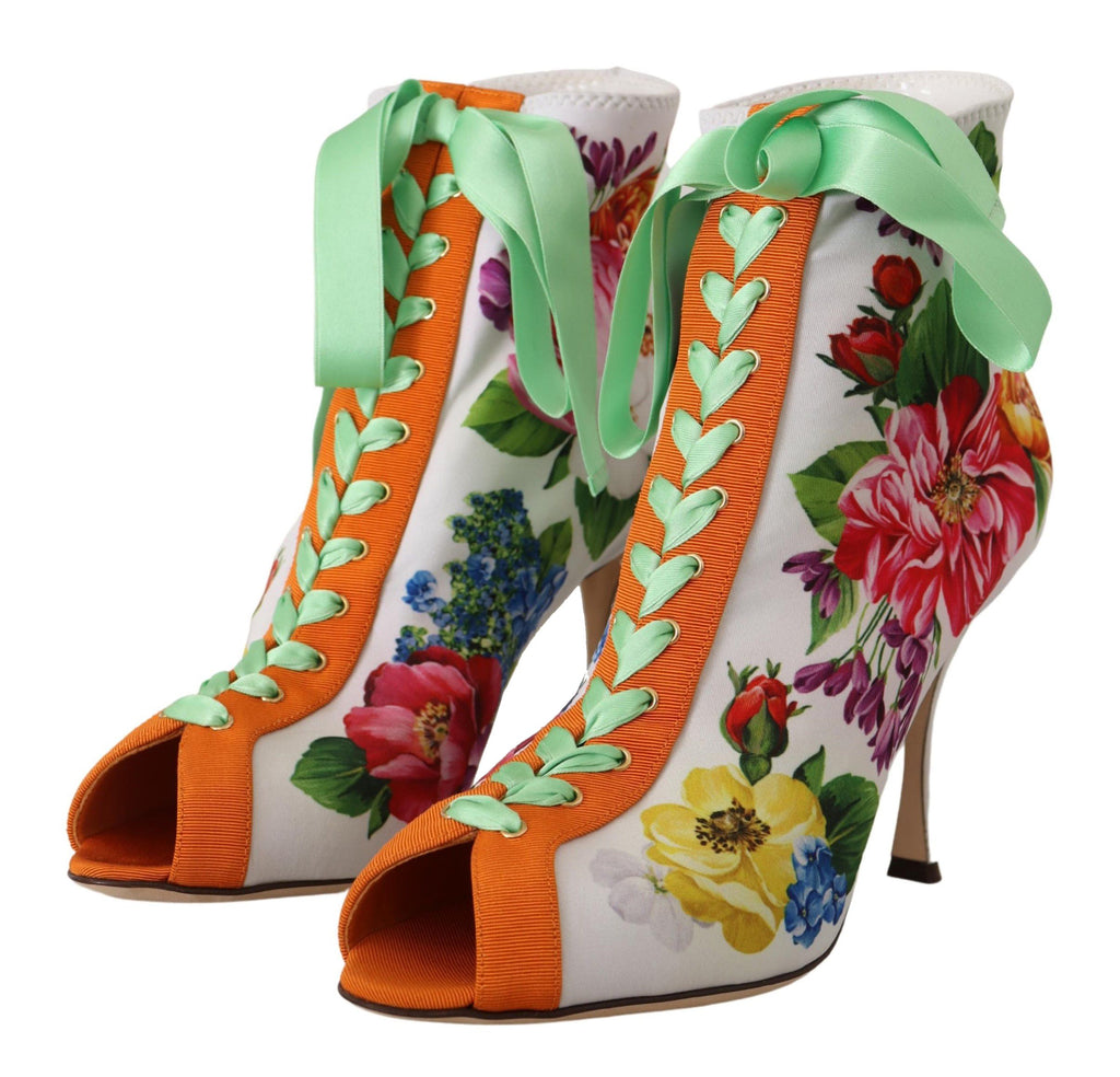 Bottes blanches en jersey extensible Dolce & Gabbana avec talons ouverts et orteils nus, chaussures élégantes et modernes.