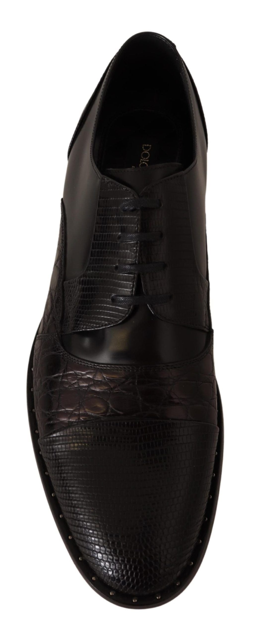 Chaussures formelles en cuir noir avec motifs exotiques de Dolce & Gabbana, élégantes et sophistiquées.
