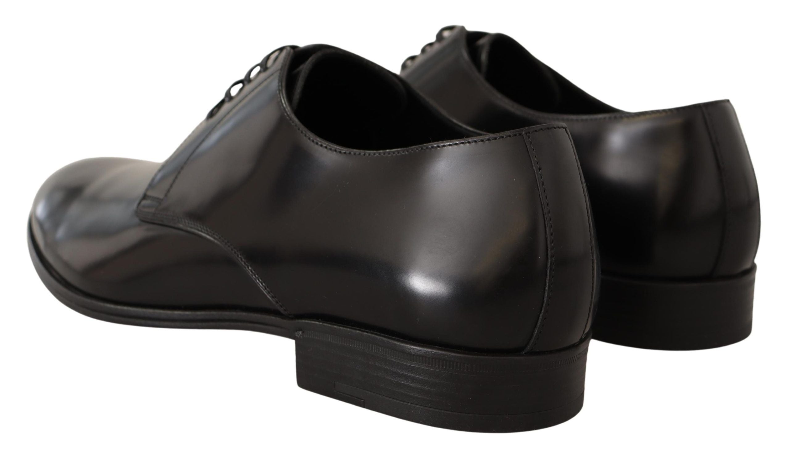 Chaussures derby pour homme en cuir noir Dolce & Gabbana avec lacets, élégantes et sophistiquées, visibles en gros plan.