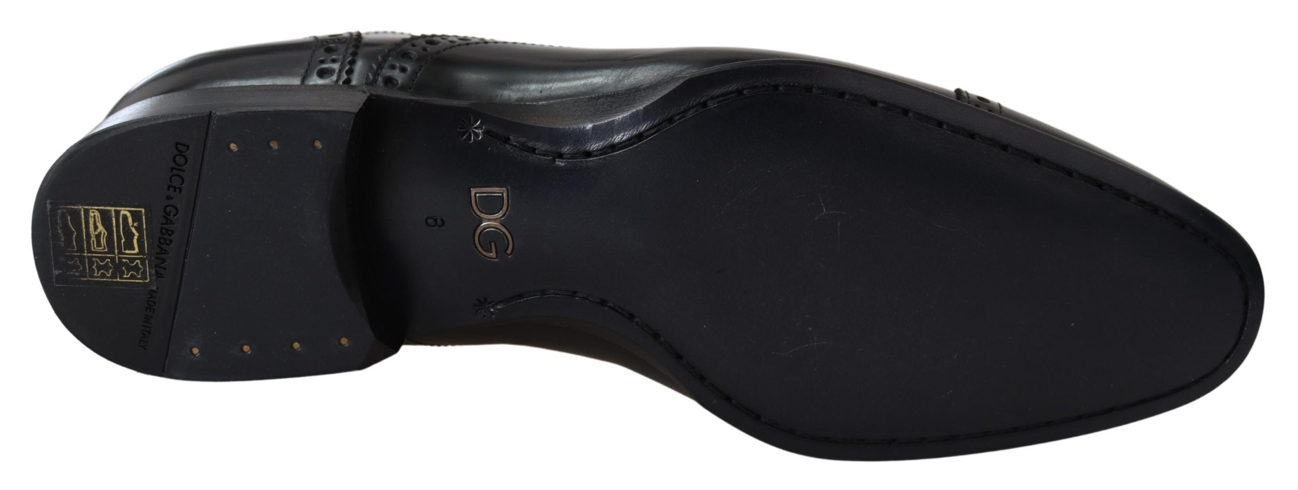 Chaussures derby formelles en cuir noir Dolce & Gabbana pour homme, loafers élégants avec finition soignée.