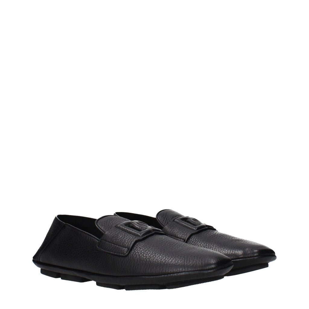 Chaussures mocassins en cuir noir Dolce & Gabbana pour homme, glissière facile à enfiler, finition élégante et raffinée.