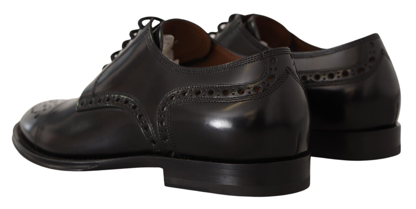 Chaussures Derby formelles en cuir noir de Dolce & Gabbana pour homme, style wingtip avec détails élégants.