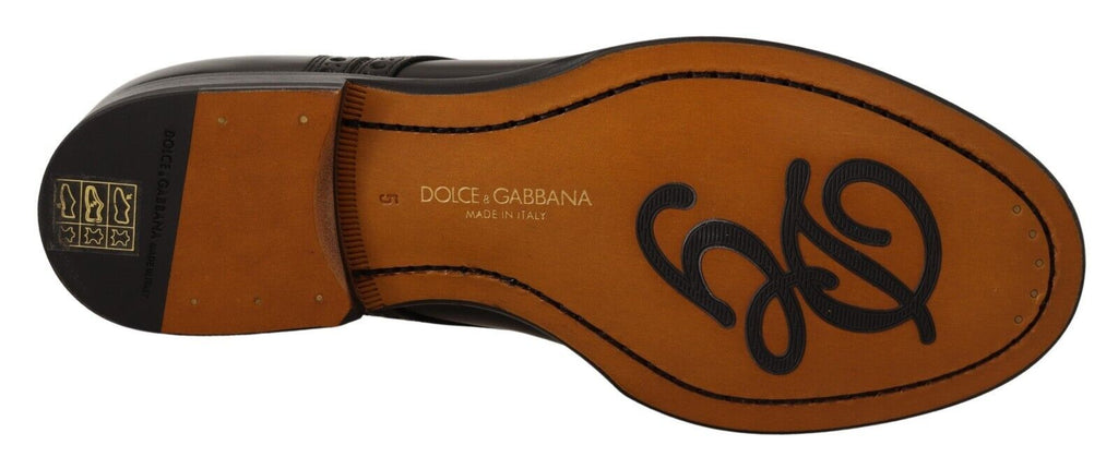 Chaussures Derby formelles en cuir noir Dolce & Gabbana pour homme avec détails wingtip, vue de face.