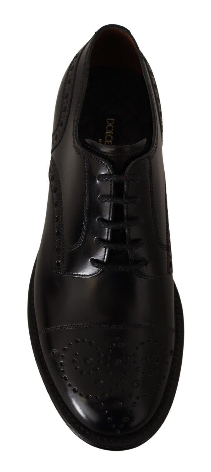 Chaussures Derby formelles pour homme Dolce & Gabbana en cuir noir avec détails wingtip, vue de face.