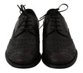 Chaussures oxford en cuir noir Dolce & Gabbana, design wingtip avec détails élégants, pour homme formel.