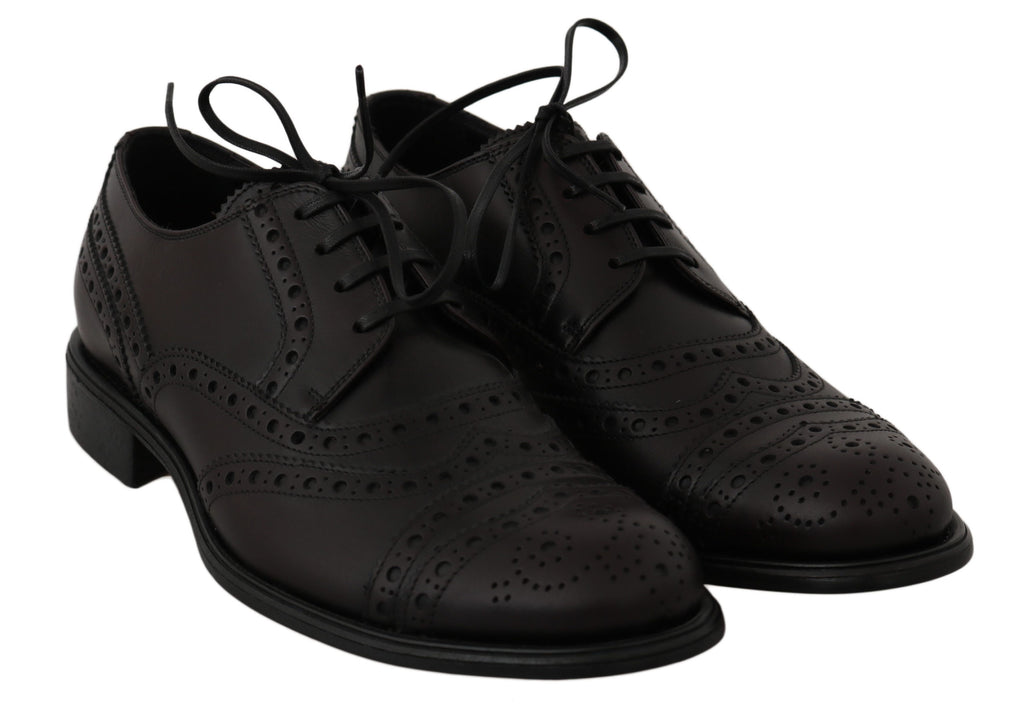 Chaussures Oxford en cuir noir Dolce & Gabbana avec bouts en aile, style élégant et sophistiqué pour homme.